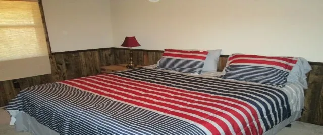 Cabin 10 master bedroom with a king bed