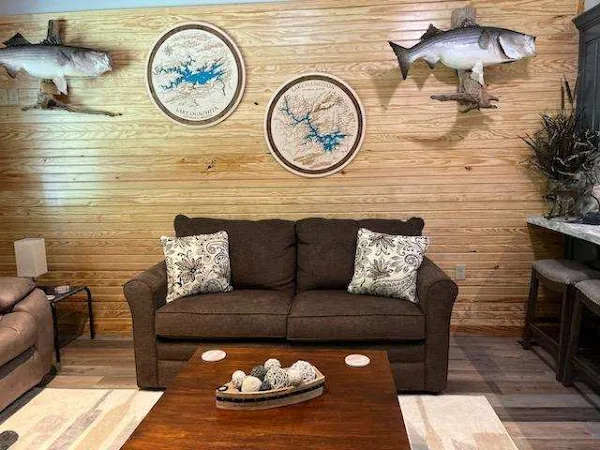 Cabin 17 living room with the sofa and lake decor