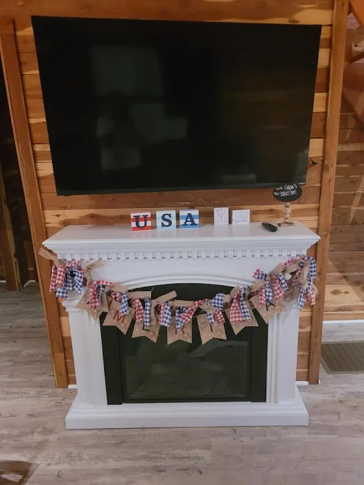 Cabin 3 living room with the fireplace and television