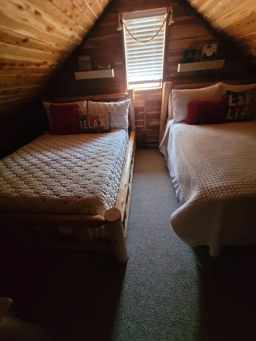 Cabin 3 upstairs bedroom with two full beds
