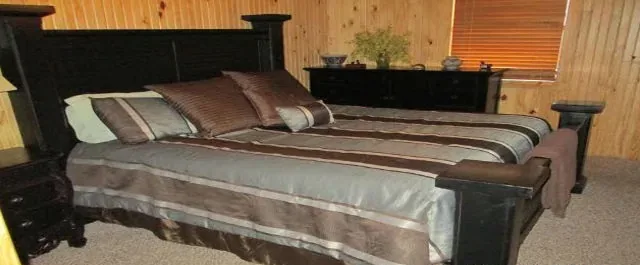 Cabin 8 master bedroom with a king bed