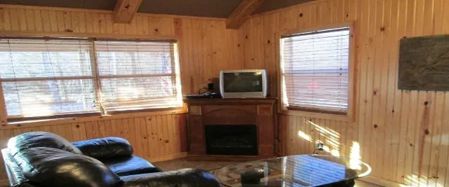 Cabin 9 living area with the corner fireplace