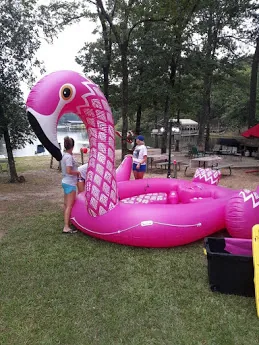Kids playing at the water with a float