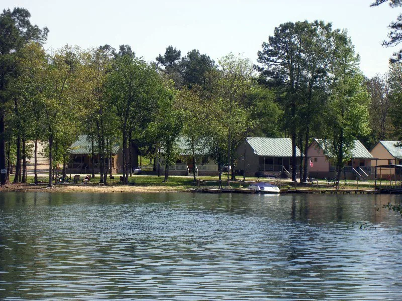 The cove at Shady Oak Trail Getaway, with cabins along the far shoreline