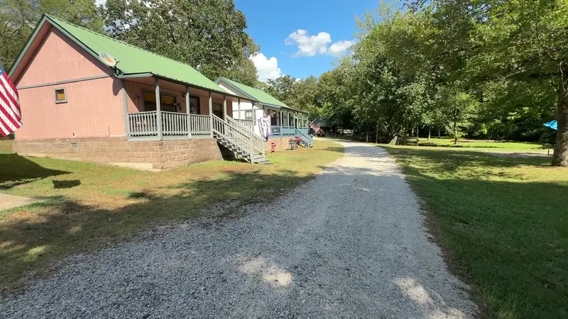 The gravel lane running past the cabins